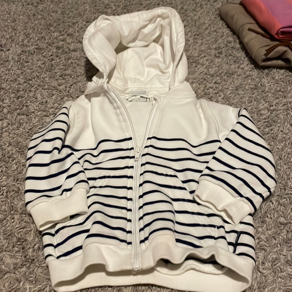 Striped sweatshirt with removable hood.